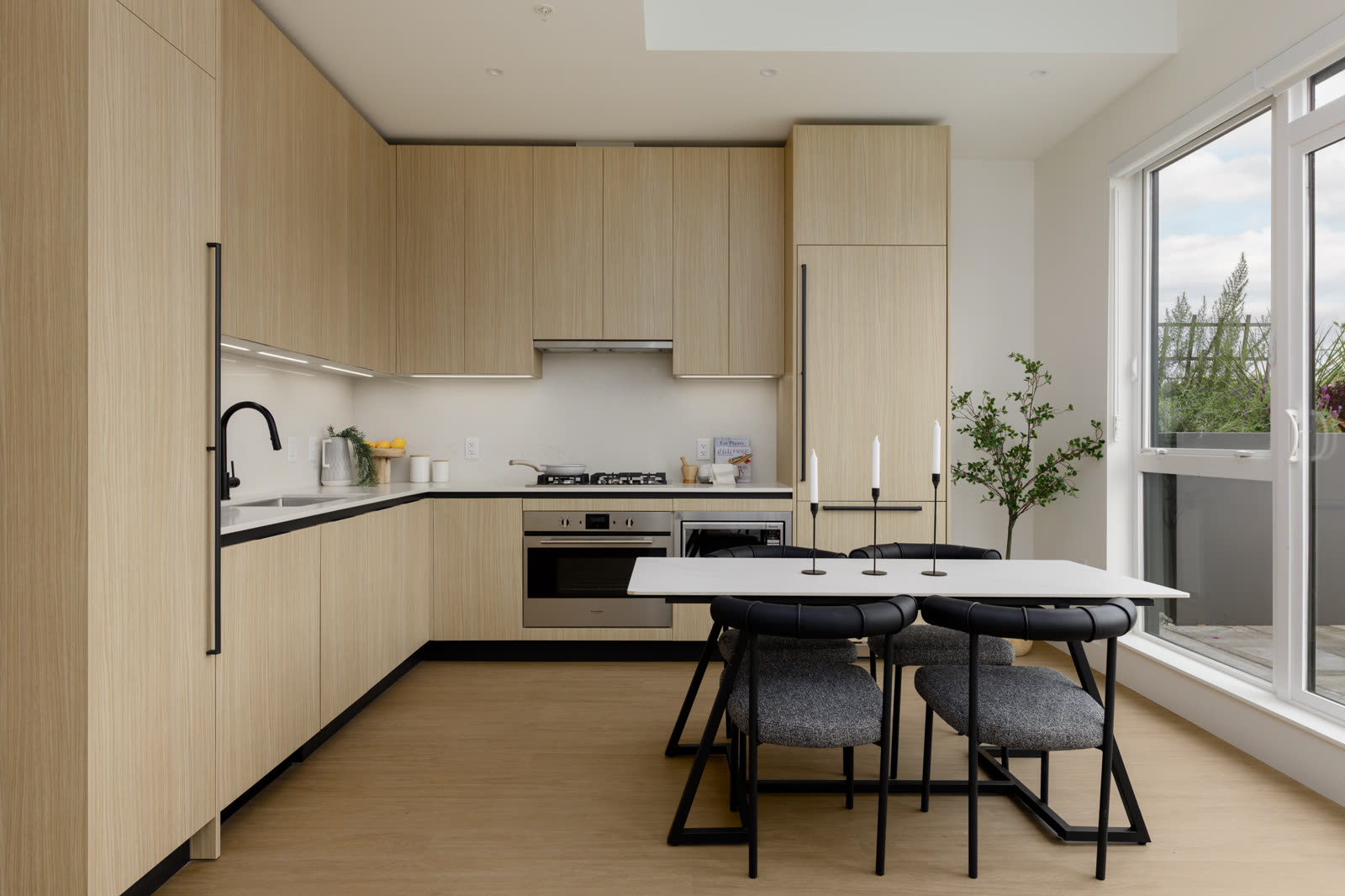 European-inspired kitchen with light wood cabinetry